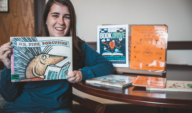 Emily Santos, ’19 organizes a book drive on campus to bring 